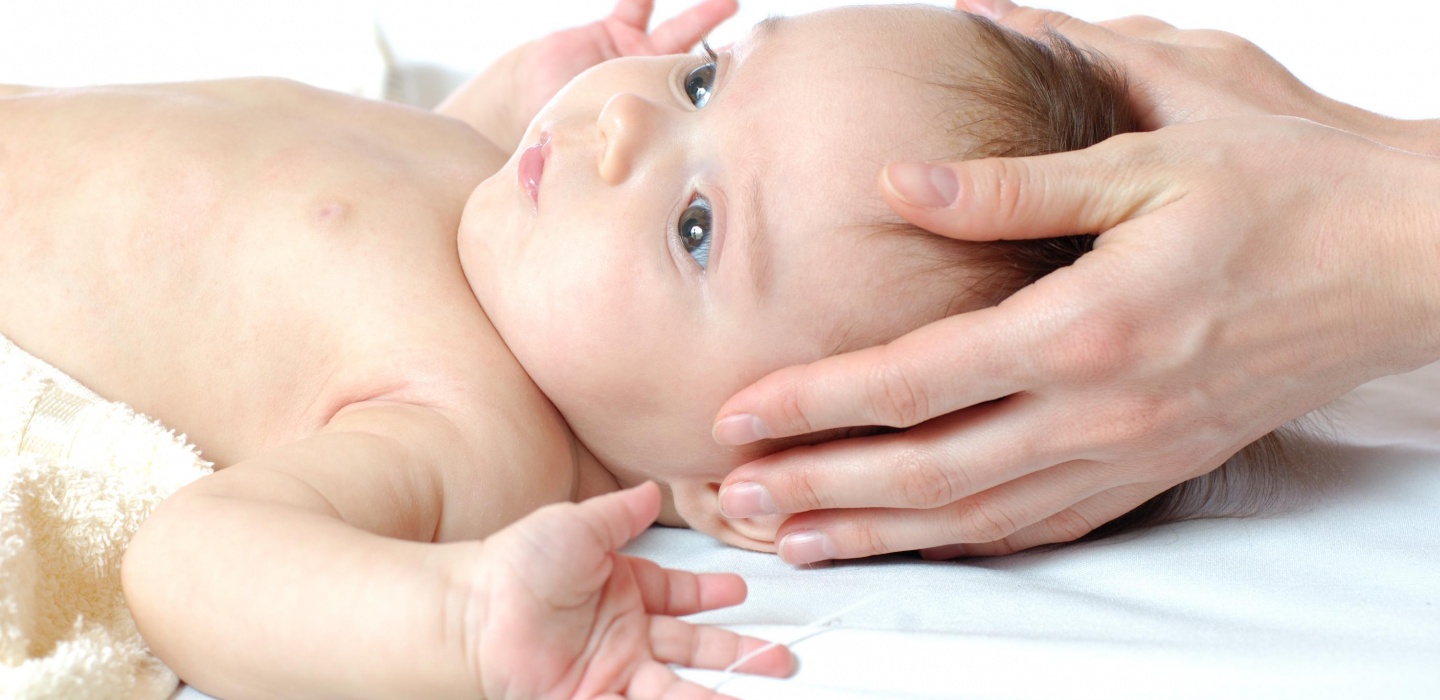 Baby having craniosacral therapy in London