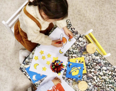 A child is playing at Cloud Twelve's play zone