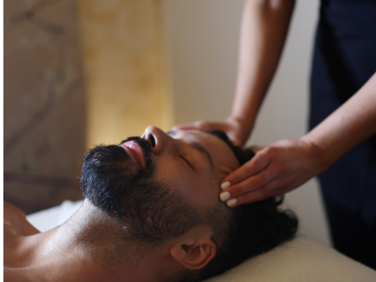 Client relaxing during a facial treatment at Cloud Twelve spa in London.