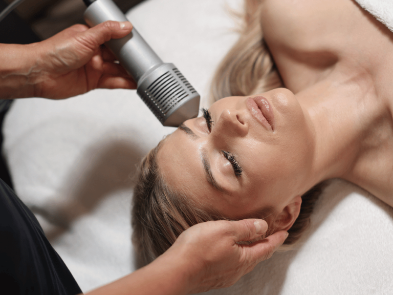 Client receiving a facial with advanced skin device at Cloud Twelve spa in London